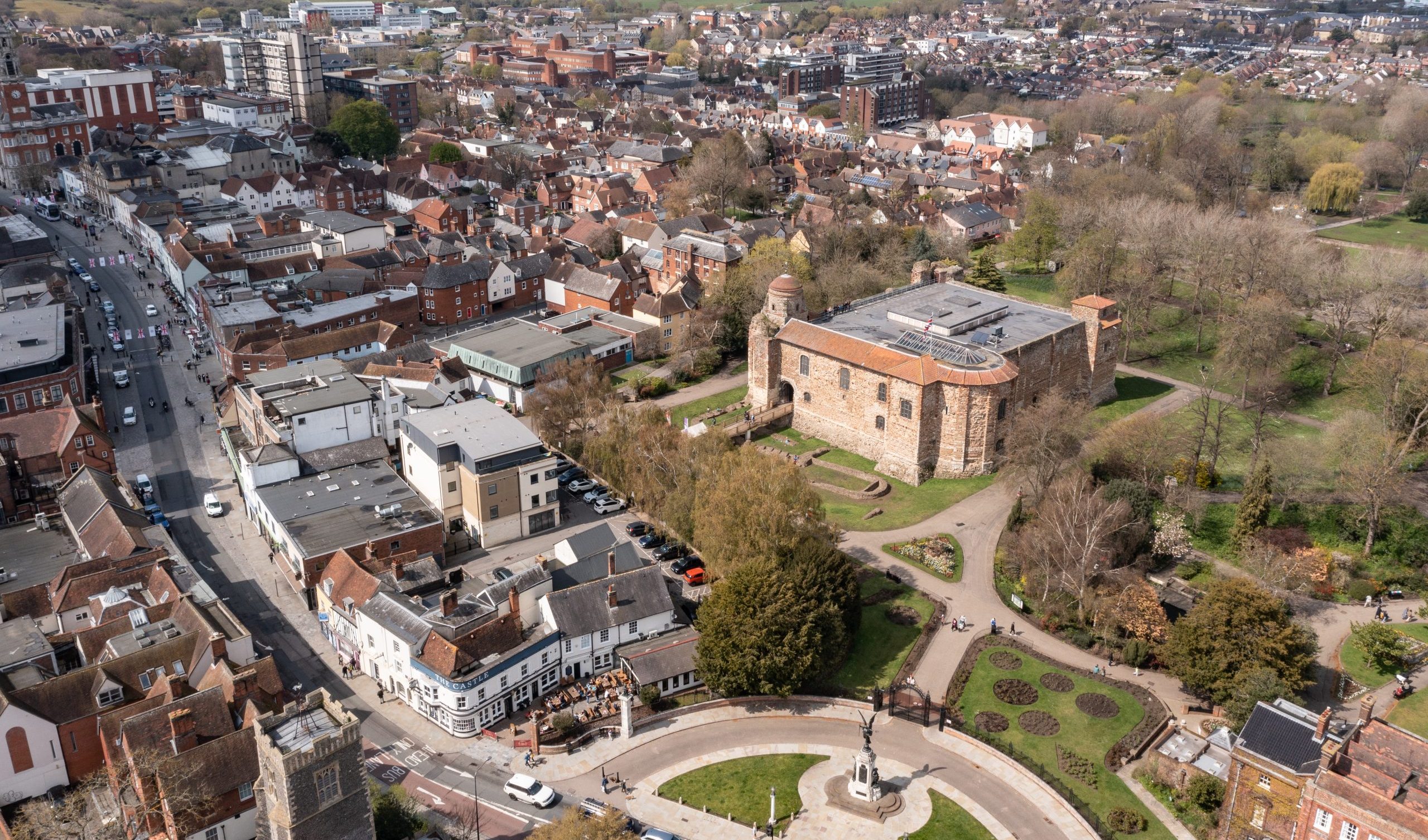 An aerial photograph showing a historic castle surrounded by other buildings.