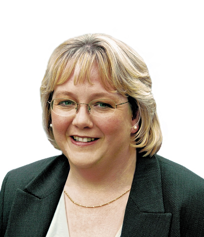 A headshot of a blonde woman with glasses.